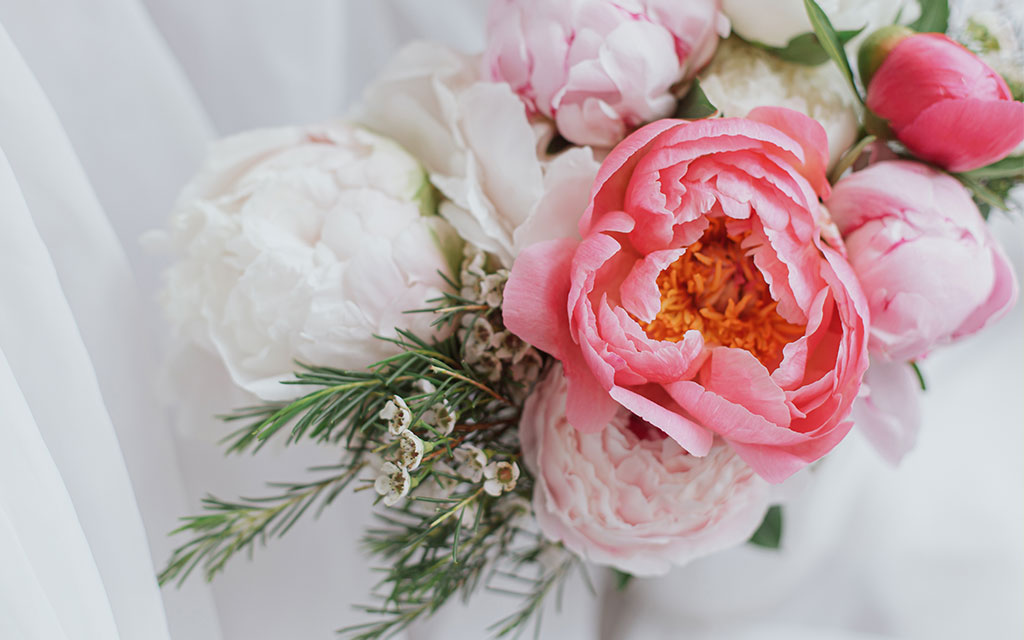 Pink and white peony flowers in elegant arrangement perfect for spring weddings and events